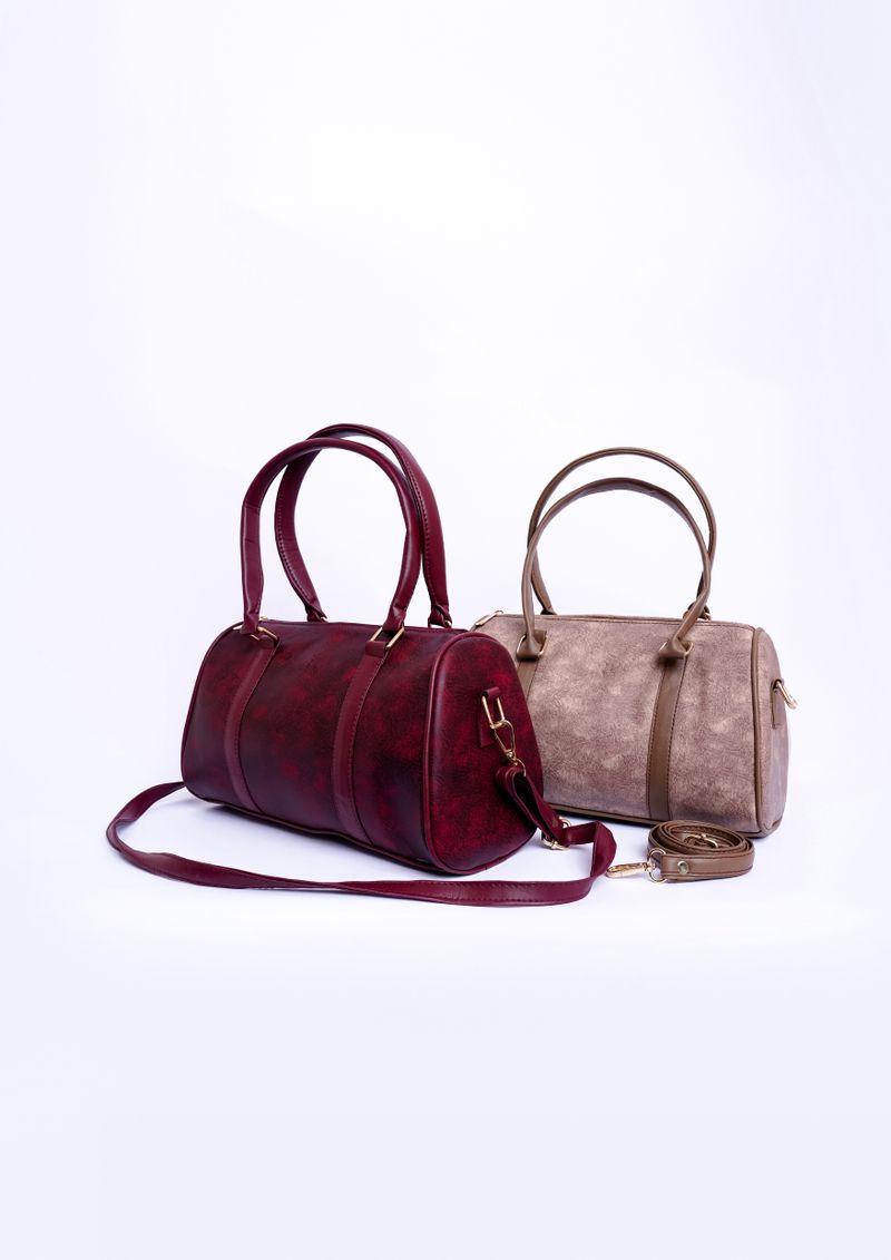 A pair of handbags against a white background