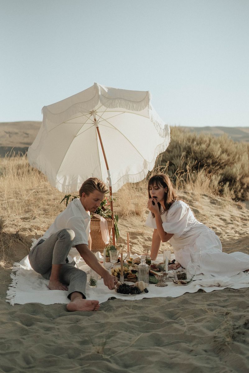 A picnic under a beach umbrella