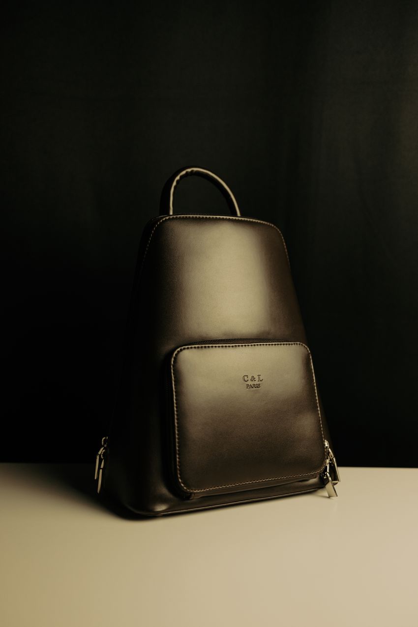 A compact structured backpack on a table