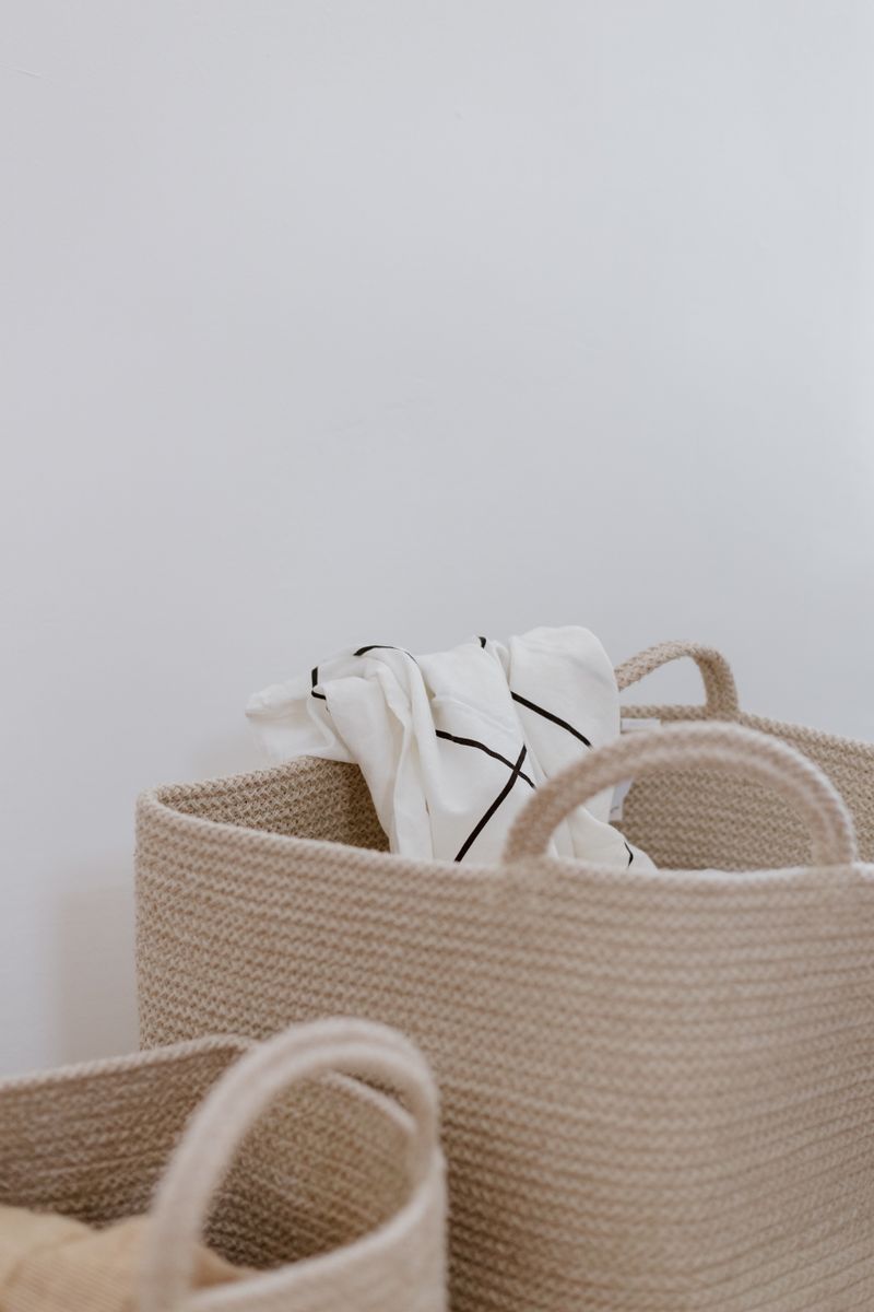 Fabric baskets holding bed linen