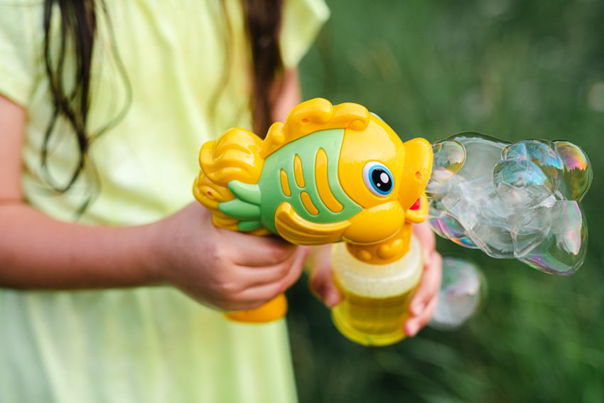A yellow fish-shaped bubble toy