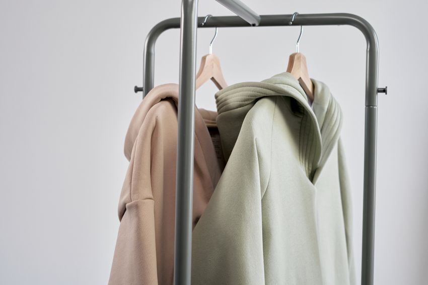 Pastel hooded sweatshirts hanging together
