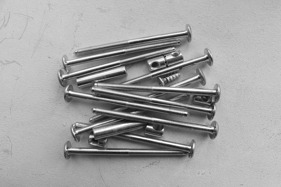 Metal nails arranged on a light surface