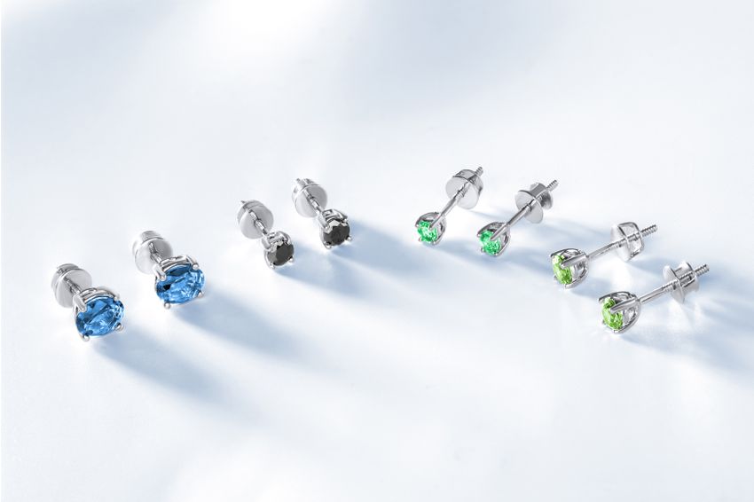 Gemstone stud earrings on a white background