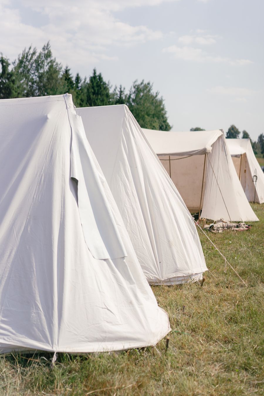 White bell tents at campsite